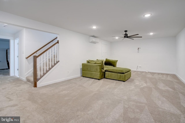 unfurnished room featuring baseboards, light colored carpet, stairway, a wall mounted air conditioner, and recessed lighting