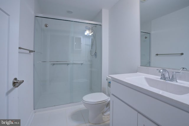 full bathroom with toilet, a stall shower, tile patterned flooring, and vanity