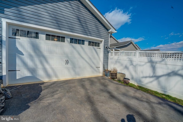 garage featuring fence