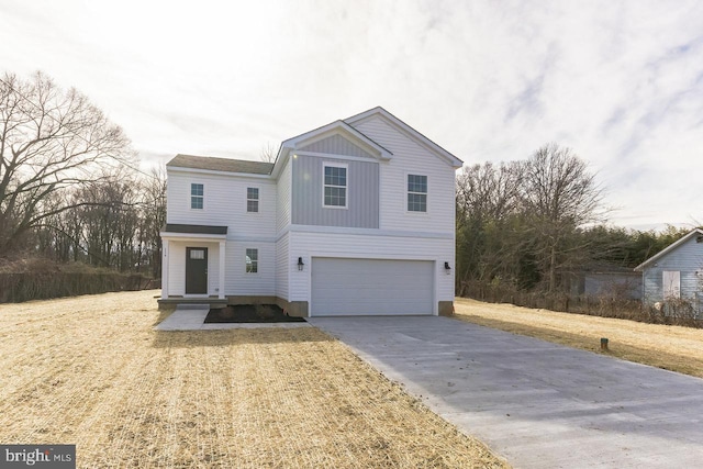 traditional home featuring a garage, concrete driveway, a front lawn, and board and batten siding