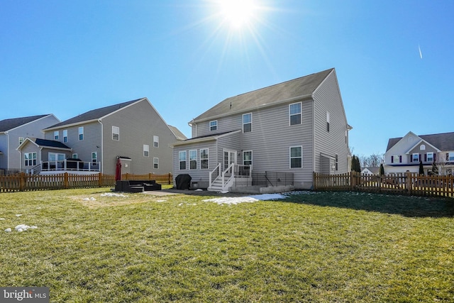 rear view of house with a patio area and a lawn