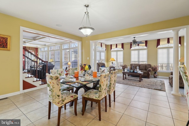 dining room featuring decorative columns, beam ceiling, ceiling fan, coffered ceiling, and light tile patterned flooring