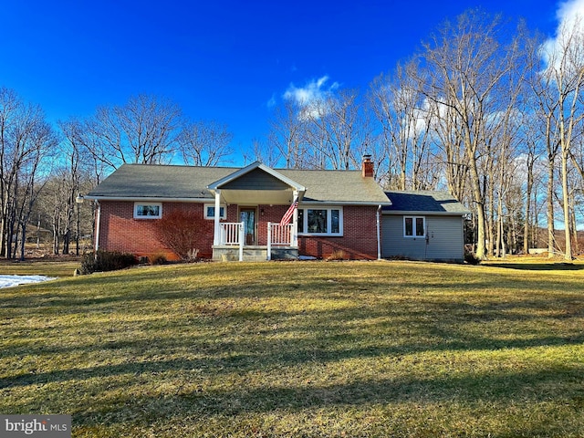 ranch-style home with a front lawn