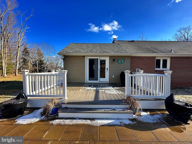 back of house with a wooden deck