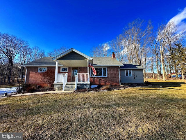 view of front of property with a front yard and covered porch