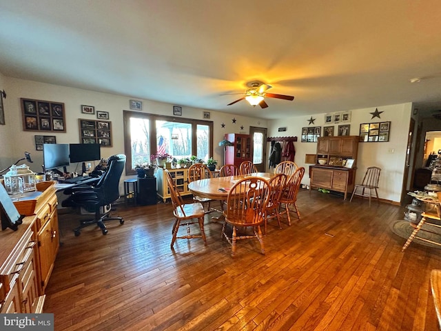 dining area with ceiling fan and dark hardwood / wood-style flooring