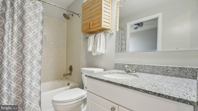 full bathroom with vanity, shower / bath combination with curtain, and toilet