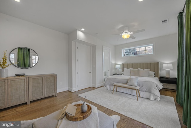 bedroom with baseboards, visible vents, a ceiling fan, wood finished floors, and recessed lighting