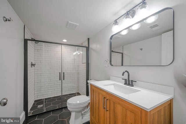 full bath with toilet, a shower stall, visible vents, and vanity