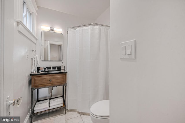 bathroom with toilet, marble finish floor, curtained shower, and vanity