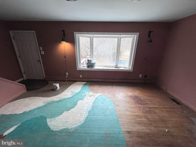 unfurnished bedroom featuring dark hardwood / wood-style floors