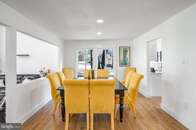 dining area featuring light wood-type flooring