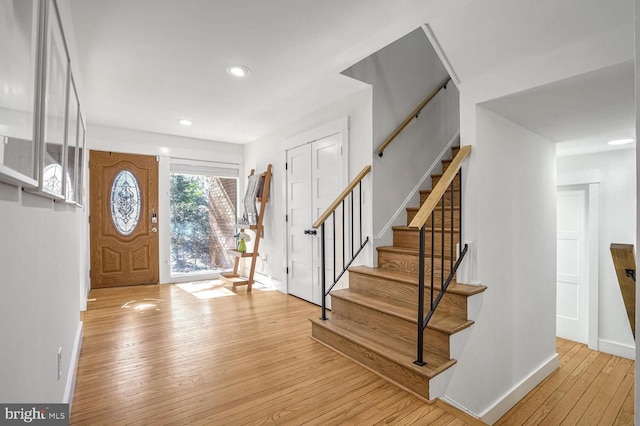 foyer entrance with light hardwood / wood-style flooring