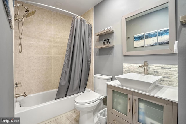 full bathroom with shower / bath combo, hardwood / wood-style floors, vanity, tasteful backsplash, and toilet