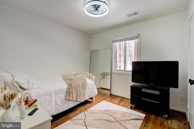 bedroom with hardwood / wood-style floors