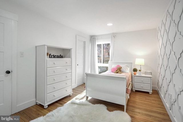 bedroom featuring hardwood / wood-style flooring