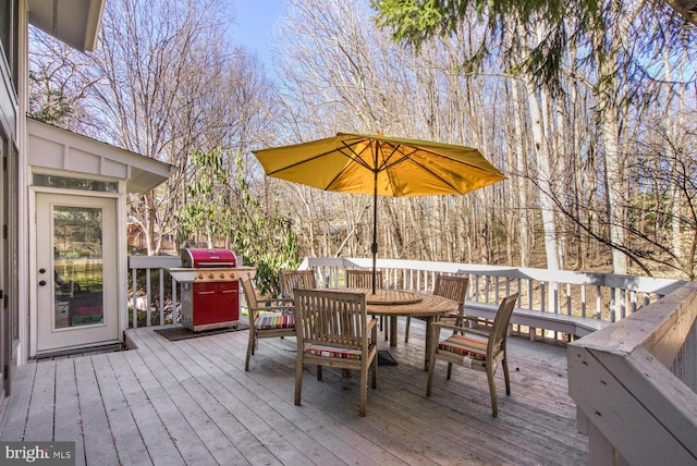 wooden terrace featuring grilling area