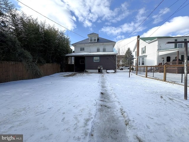 view of snow covered property