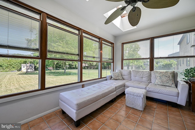 sunroom / solarium with a skylight and ceiling fan