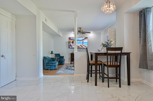 dining room with ceiling fan with notable chandelier