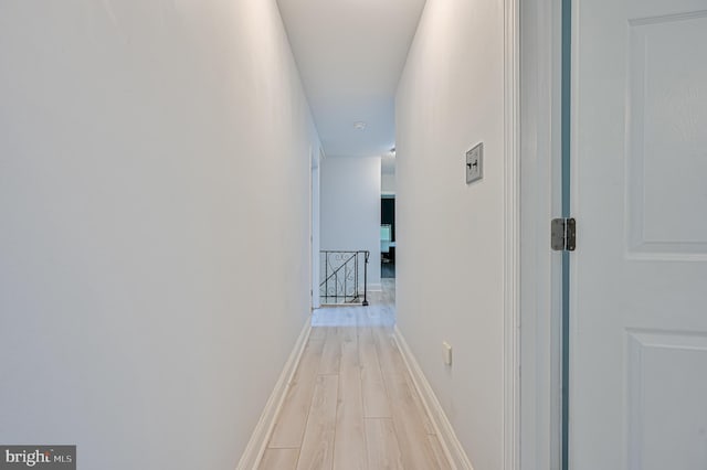 hallway featuring light hardwood / wood-style flooring