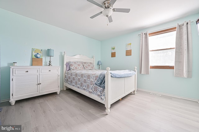 bedroom with ceiling fan and light hardwood / wood-style flooring