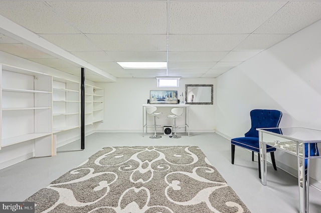 basement featuring a paneled ceiling