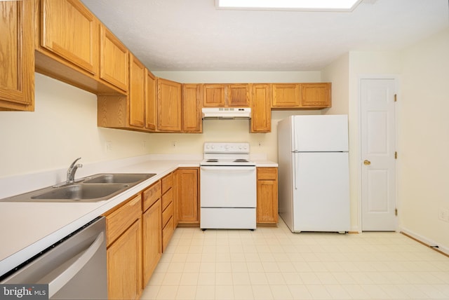 kitchen featuring sink and white appliances