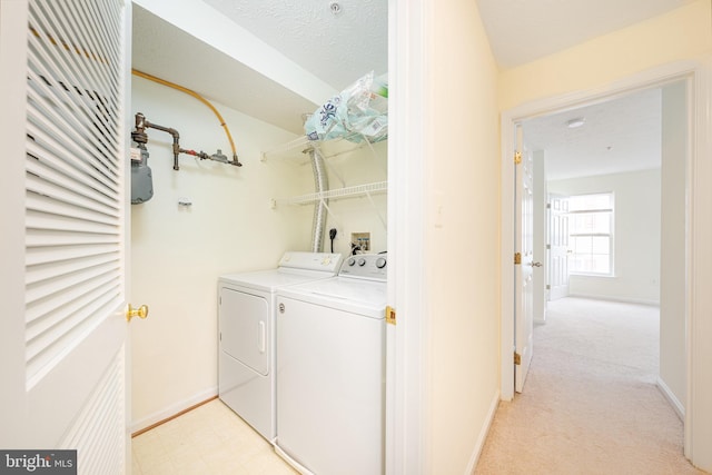 laundry area with washing machine and dryer