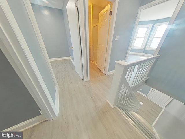 corridor featuring light wood-type flooring