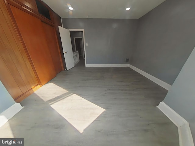 spare room with wood-type flooring