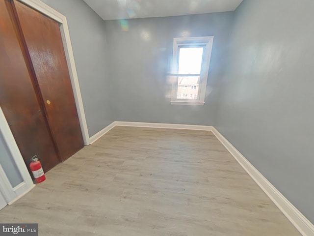 spare room featuring light hardwood / wood-style floors