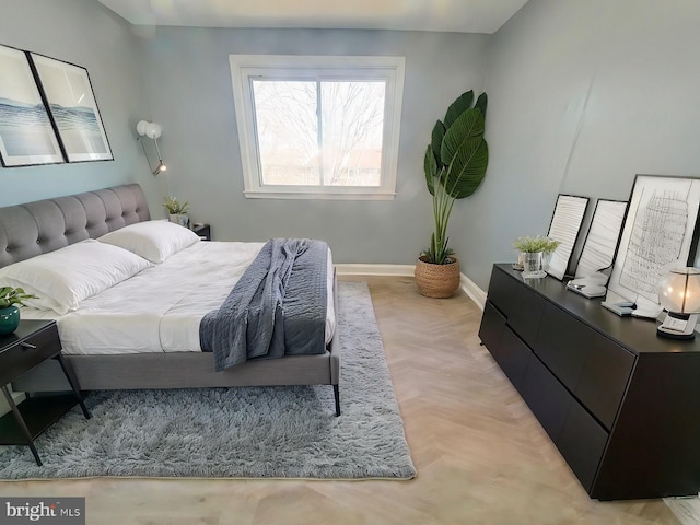 bedroom featuring light parquet flooring