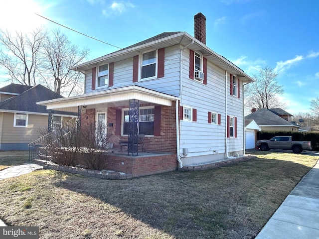 view of front of home featuring cooling unit, covered porch, and a front lawn