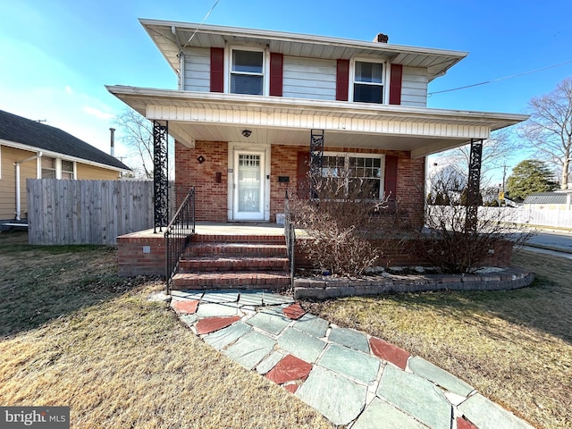 view of front of home featuring a porch and a front yard