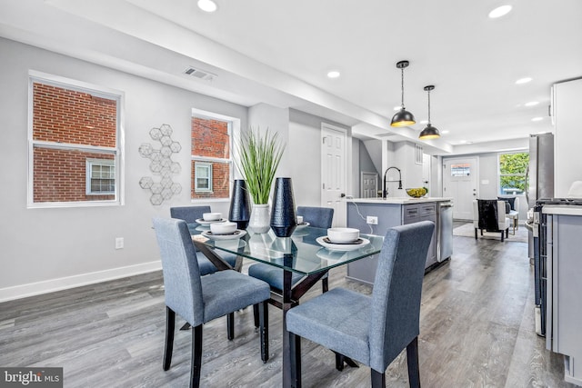 dining area with dark hardwood / wood-style flooring