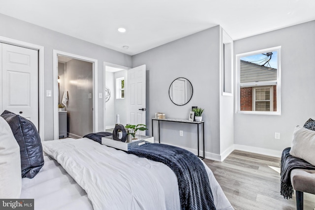 bedroom with light wood-type flooring