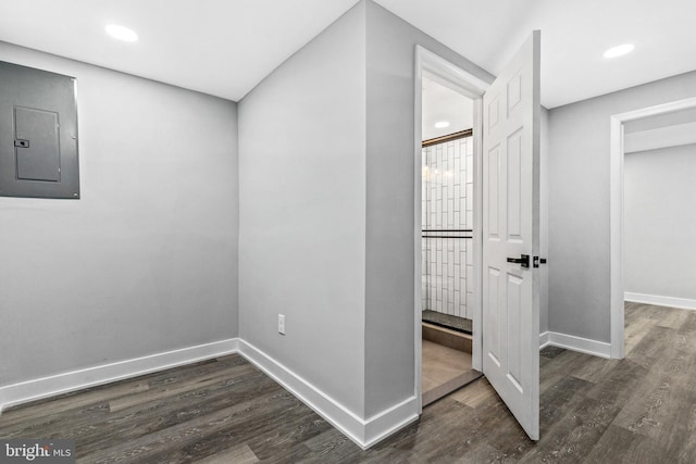 interior space with dark wood-type flooring and electric panel