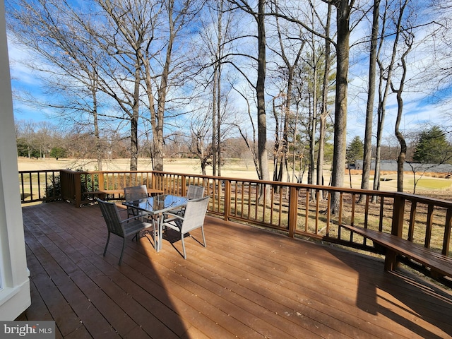 wooden terrace with outdoor dining area