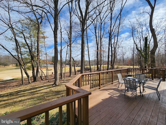 deck with outdoor dining area