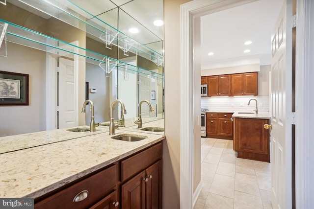 bathroom with tasteful backsplash, recessed lighting, vanity, and tile patterned floors