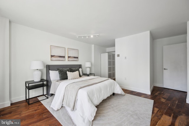 bedroom featuring dark wood-type flooring