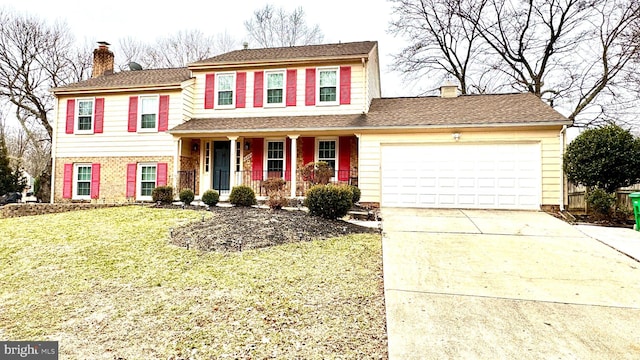 view of front of home with a porch, a garage, and a front lawn