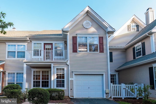 townhome / multi-family property featuring a garage