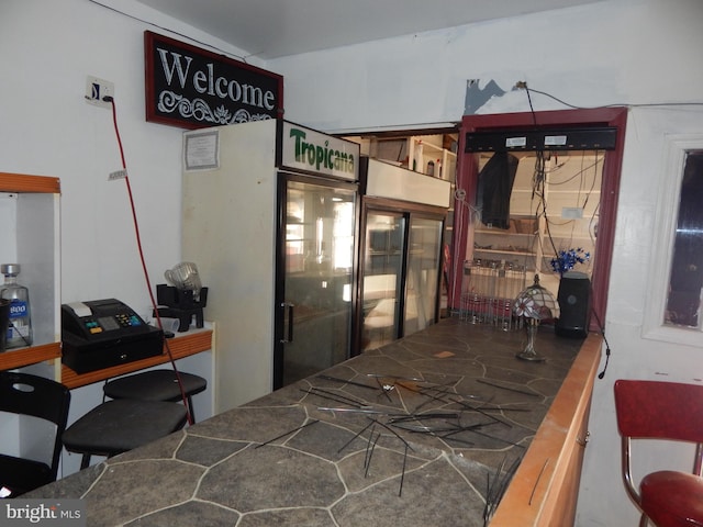 bedroom with refrigerator