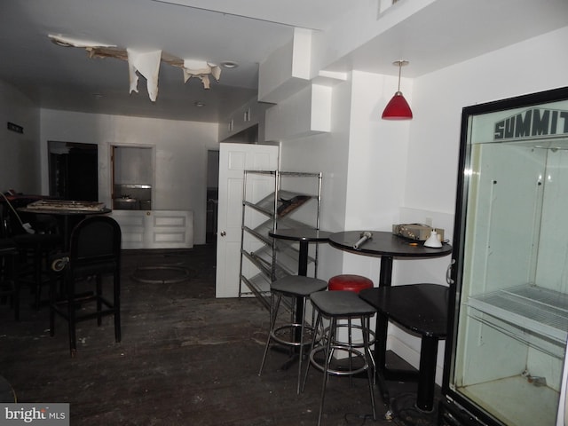 dining area featuring dark wood-type flooring