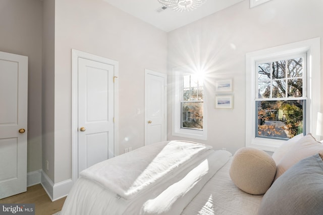 bedroom with light wood-type flooring