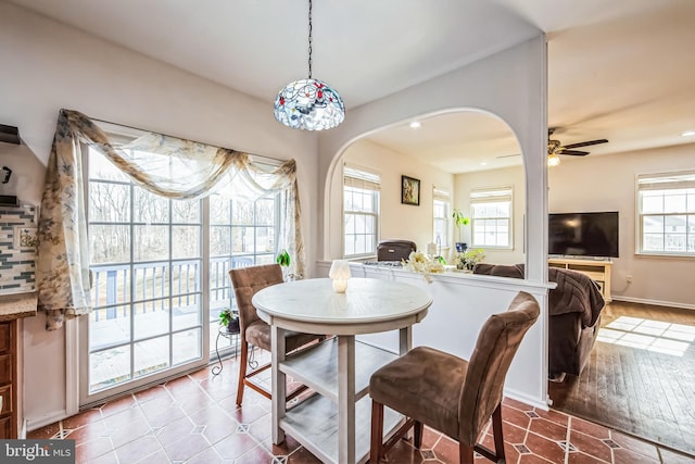 dining space with ceiling fan