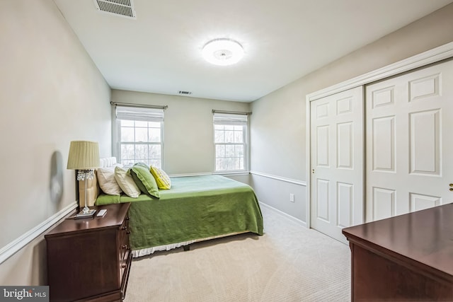 bedroom with a closet and carpet