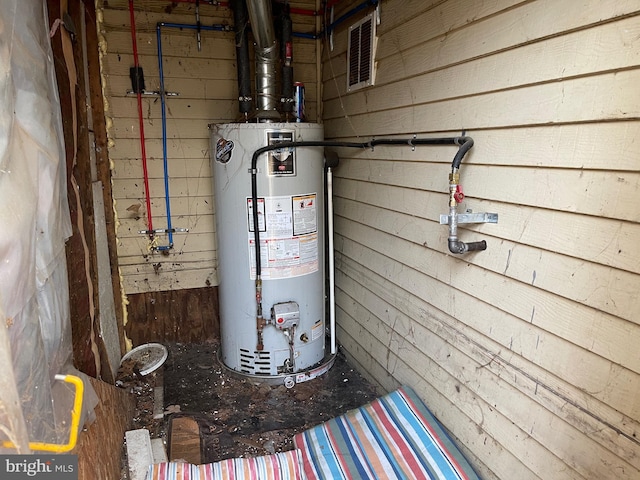 utility room featuring gas water heater